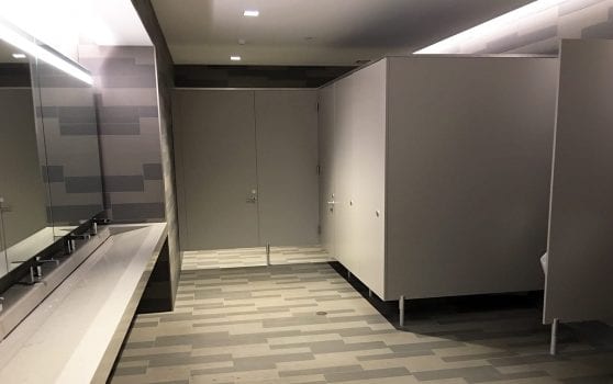 Restroom Featuring Privada Toilet Partitions